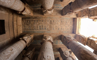 Ancient Egyptian temple columns with hieroglyphics, Aswan, part of Nile Serenade tour.
