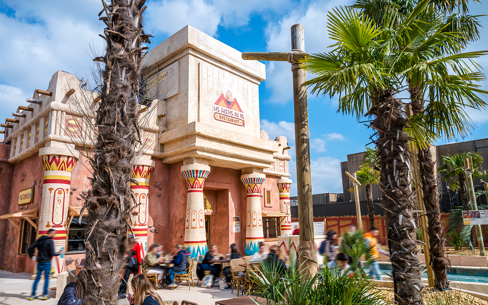 Les Fastes du Nil restaurant exterior at Parc Astérix with Egyptian-themed architecture.