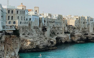 Cliffside buildings overlooking the sea in Polignano a Mare, Italy.