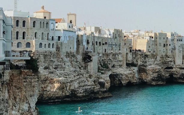 Cliffside buildings overlooking the sea in Polignano a Mare, Italy.