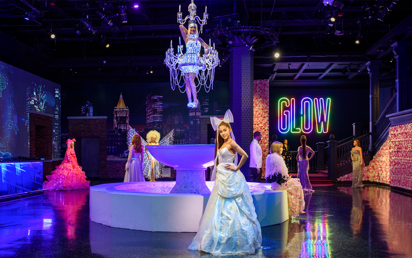 Wax figures of music artists at Madame Tussauds New York, featuring Ariana Grande and Sia.