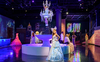 Wax figures of music artists at Madame Tussauds New York, featuring Ariana Grande and Sia.