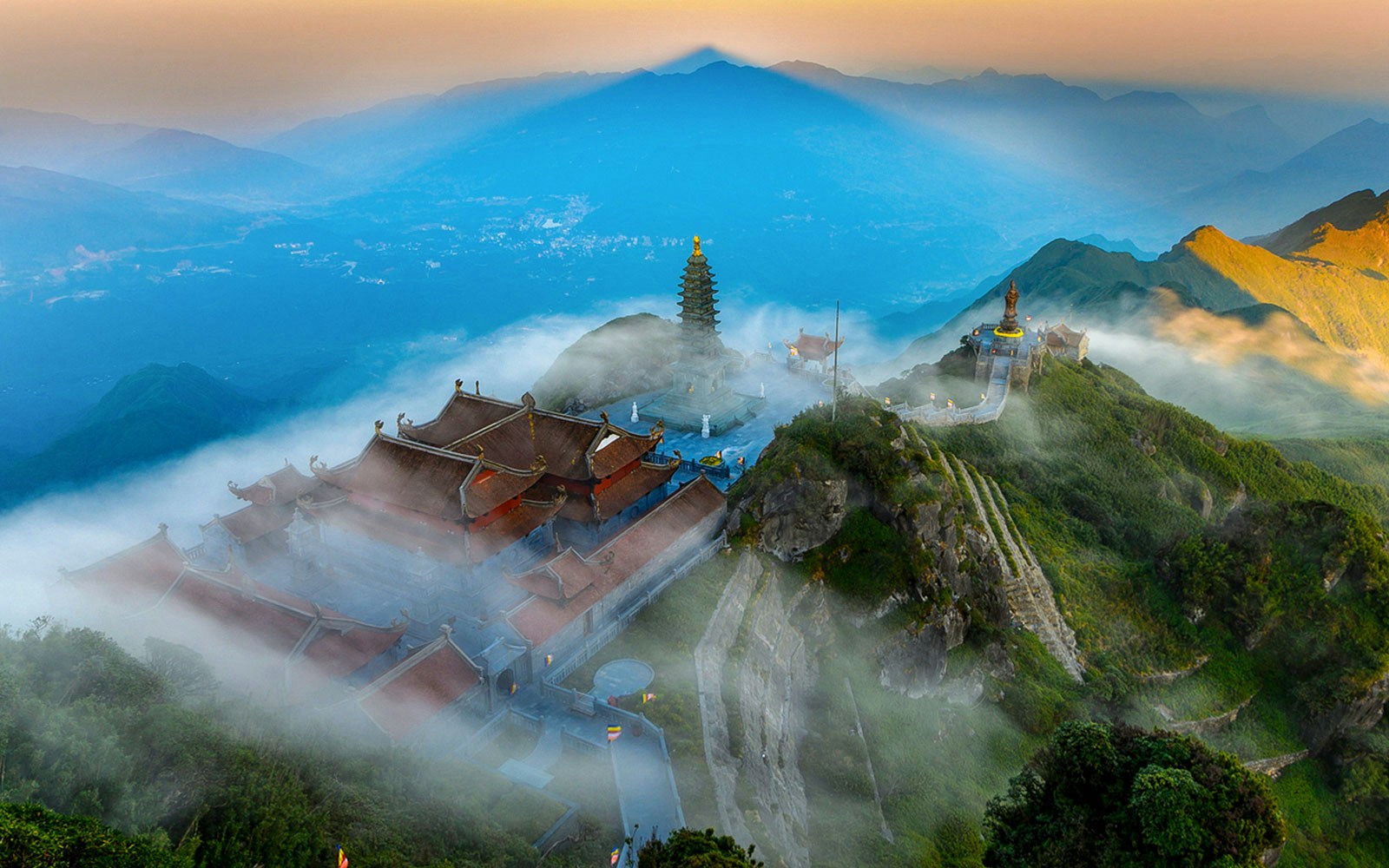 Cable car ascending Fansipan Mountain at Sun World Fansipan Legend, Vietnam, surrounded by lush greenery.