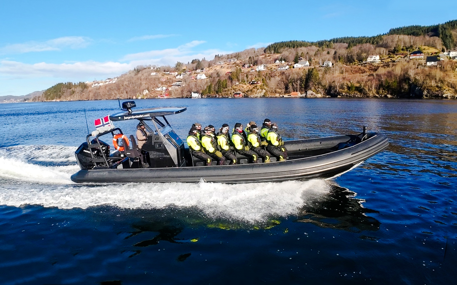 Guests on a RIB boat enjoying Alversund Fjord Safari in Norway.