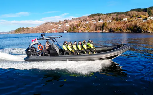 Guests on a RIB boat enjoying Alversund Fjord Safari in Norway.