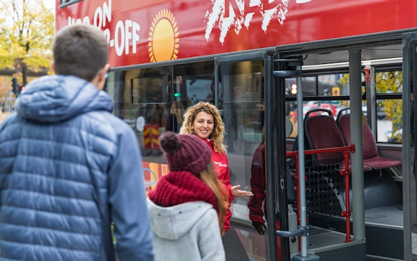 People boarding hop-on hop-off bus in Stockholm.