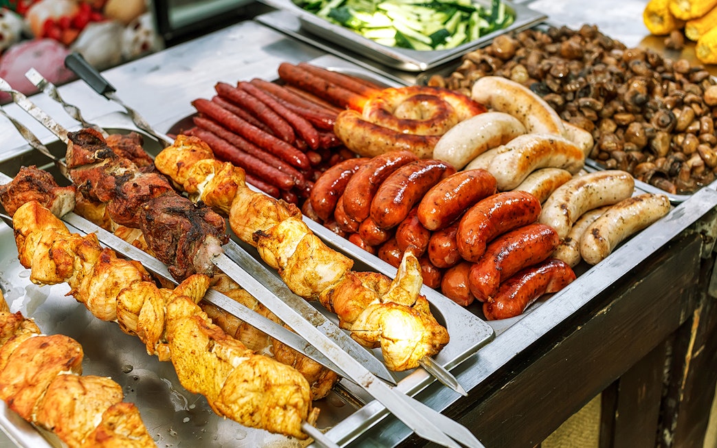 Assorted grilled meats and sausages at a buffet in Kuranda.