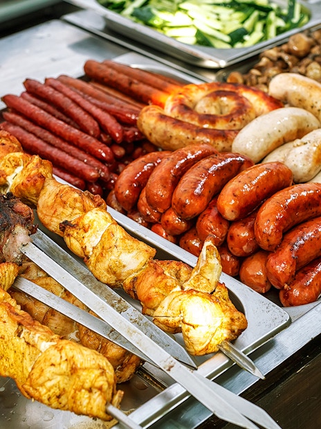 Assorted grilled meats and sausages at a buffet in Kuranda.