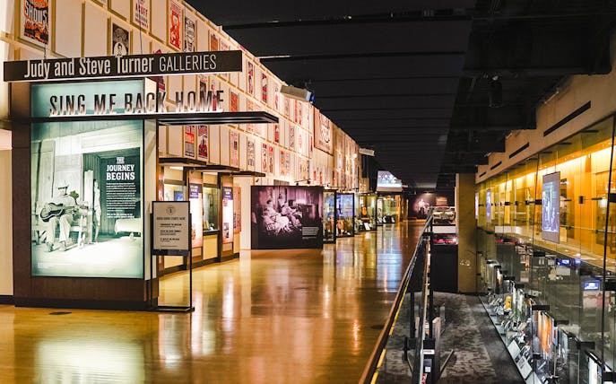 Country Music Hall of Fame gallery with exhibits and posters in Nashville.
