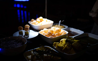 Indian snacks and dishes served on a Dubai Marina luxury dhow cruise.