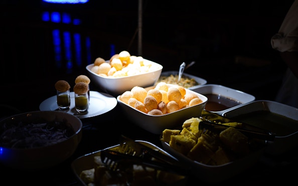 Indian snacks and dishes served on a Dubai Marina luxury dhow cruise.