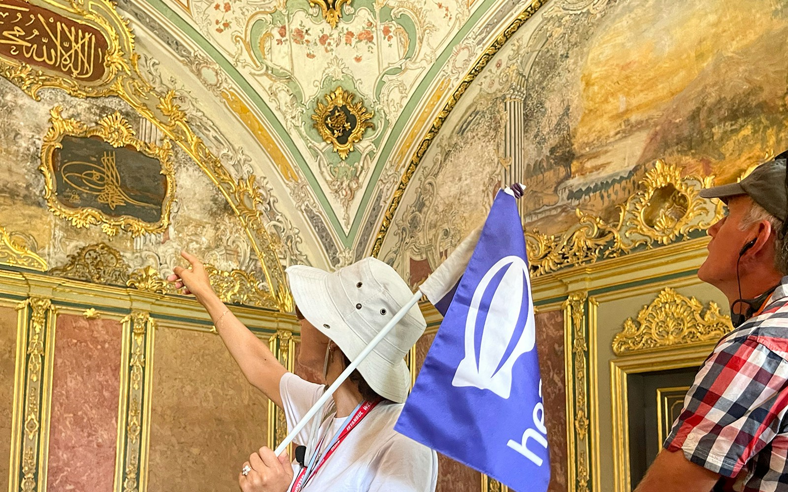 Guide explaining Topkapi Palace interiors in Istanbul.