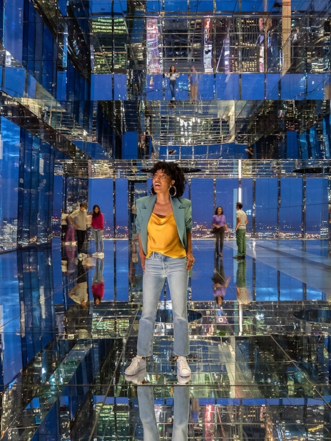 Visitors exploring mirrored observation deck at Summit One Vanderbilt, New York City.