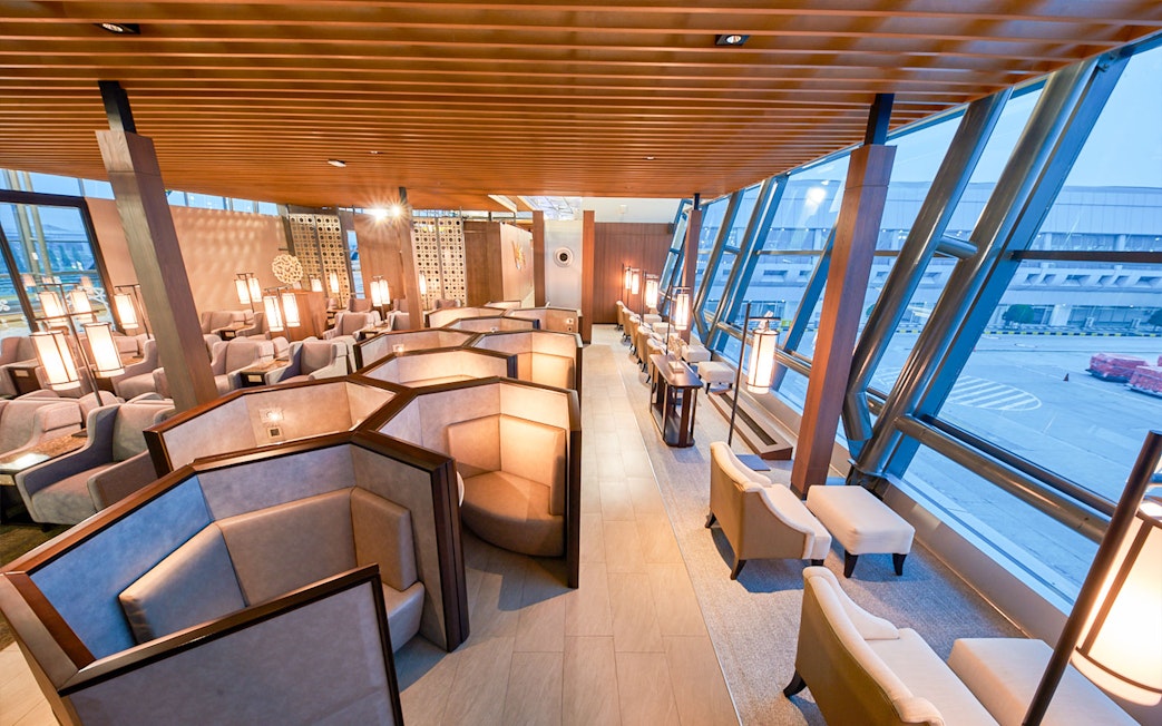 Sapphire Lounge seating area, T3 International Departures, near Gate 7, with airport view.