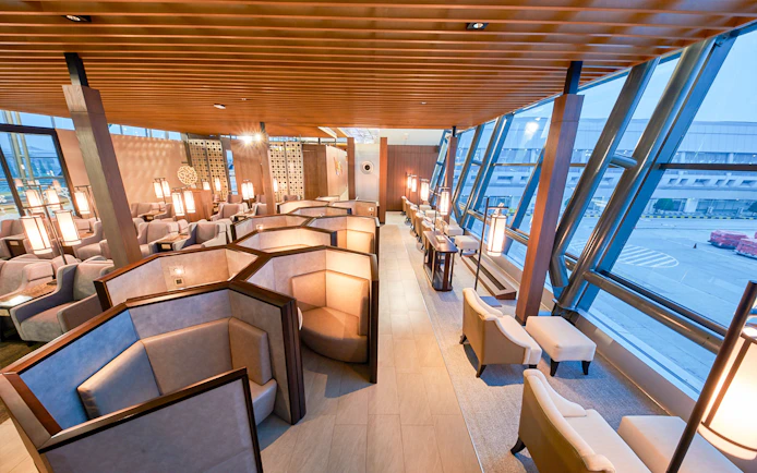 Sapphire Lounge seating area, T3 International Departures, near Gate 7, with airport view.