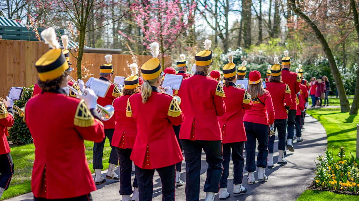 parade band standing in a flower garden in the Netherlands.