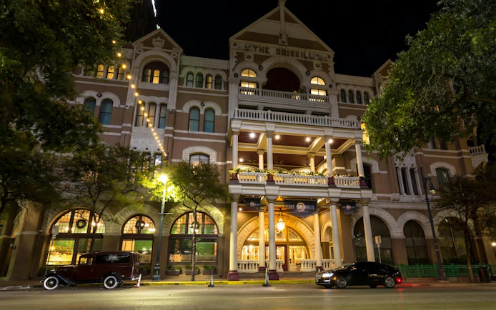 Driskill Hotel facade at night, part of Ghosts of Austin exploration game.