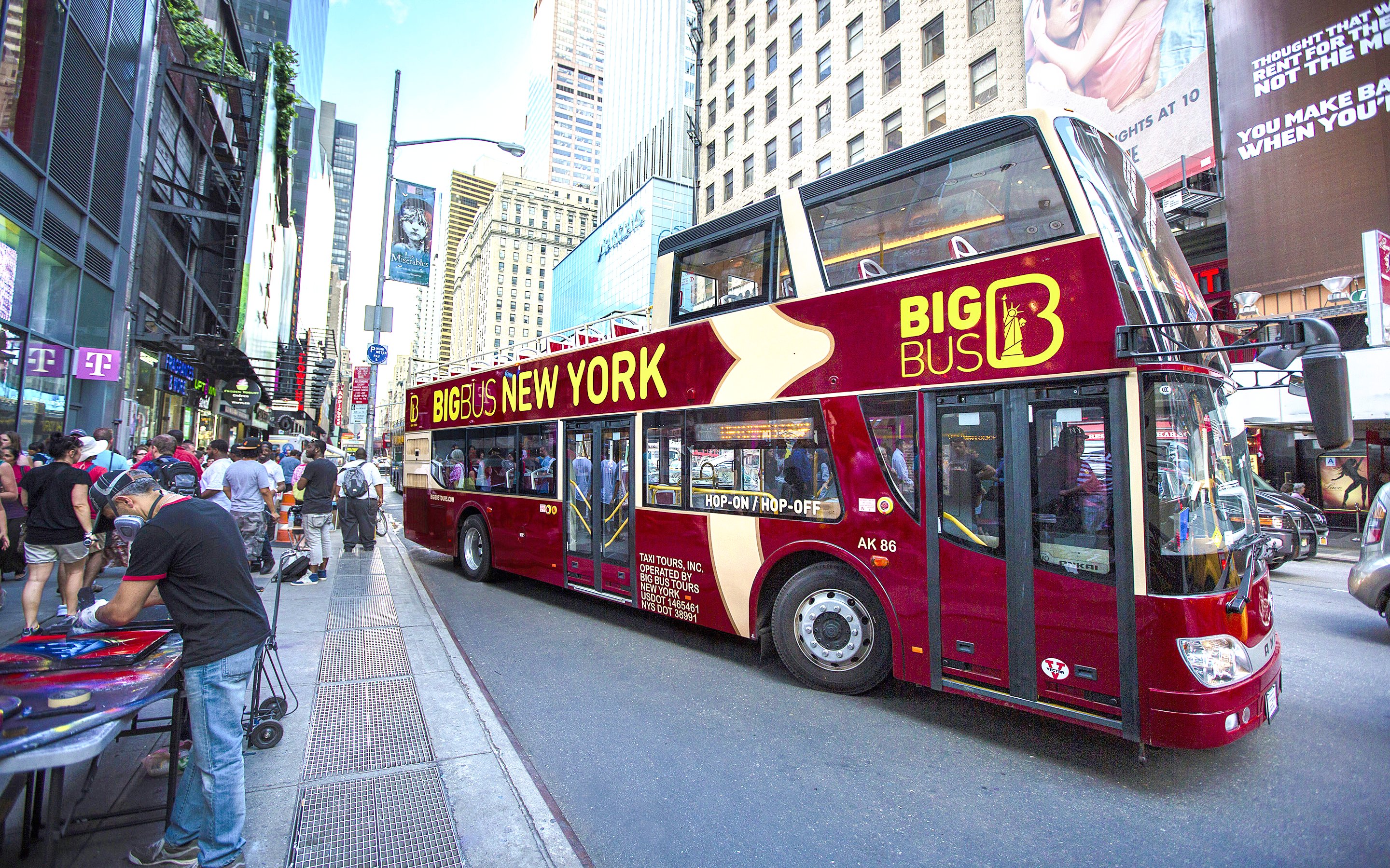 Big Bus hop-on hop-off tour bus in New York City street.
