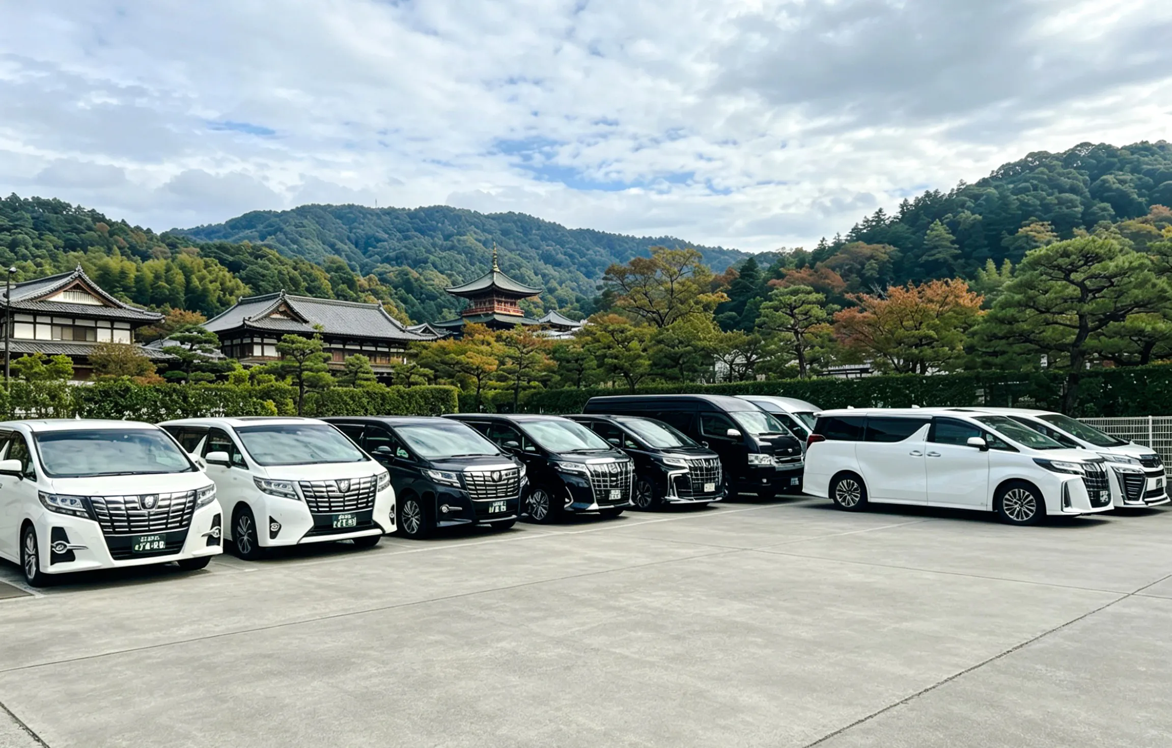 Private transfer vehicles at Kansai Airport with Kyoto temple backdrop.