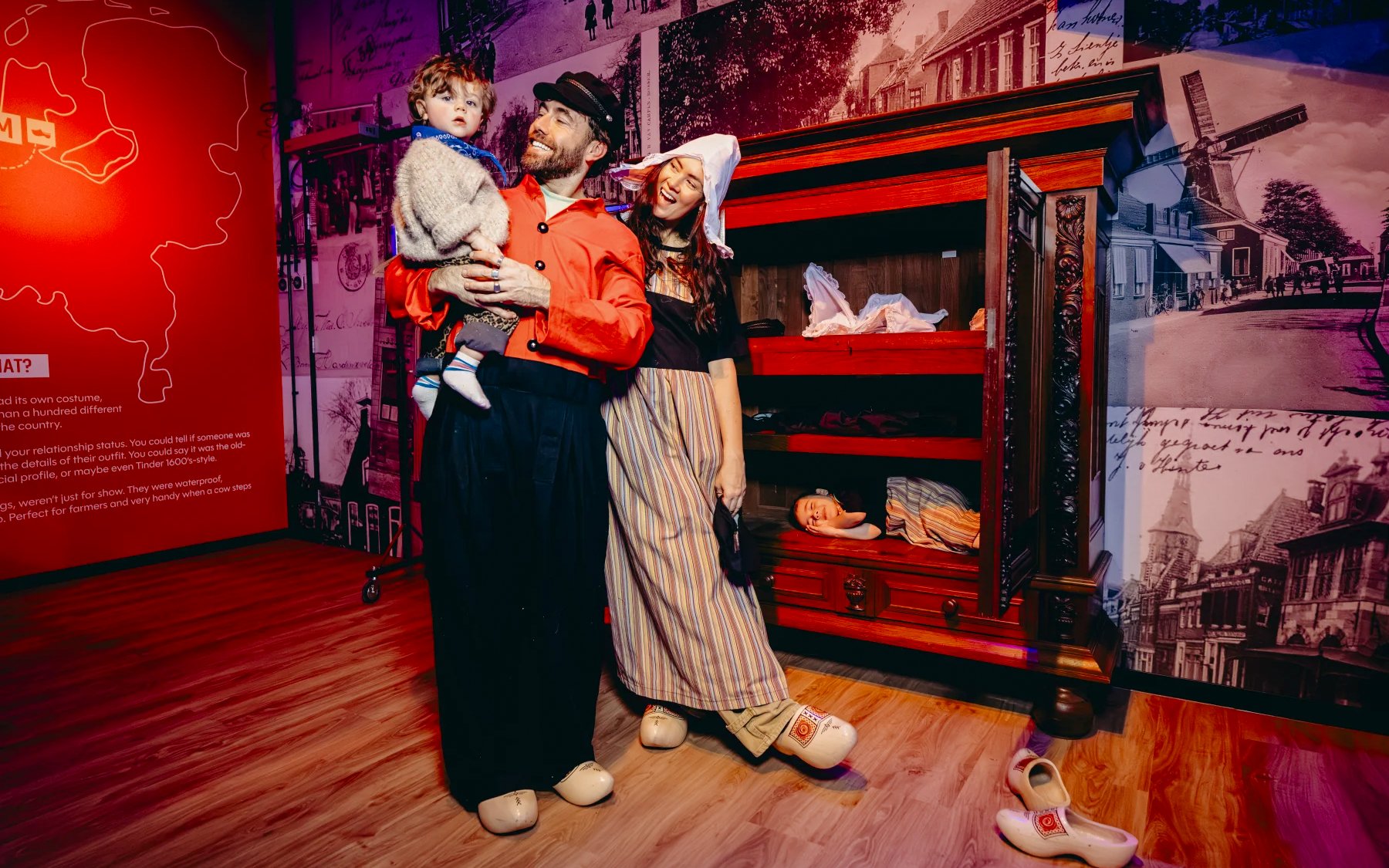 Family in traditional Dutch attire at Clogs Room, Highlights of Holland exhibit.