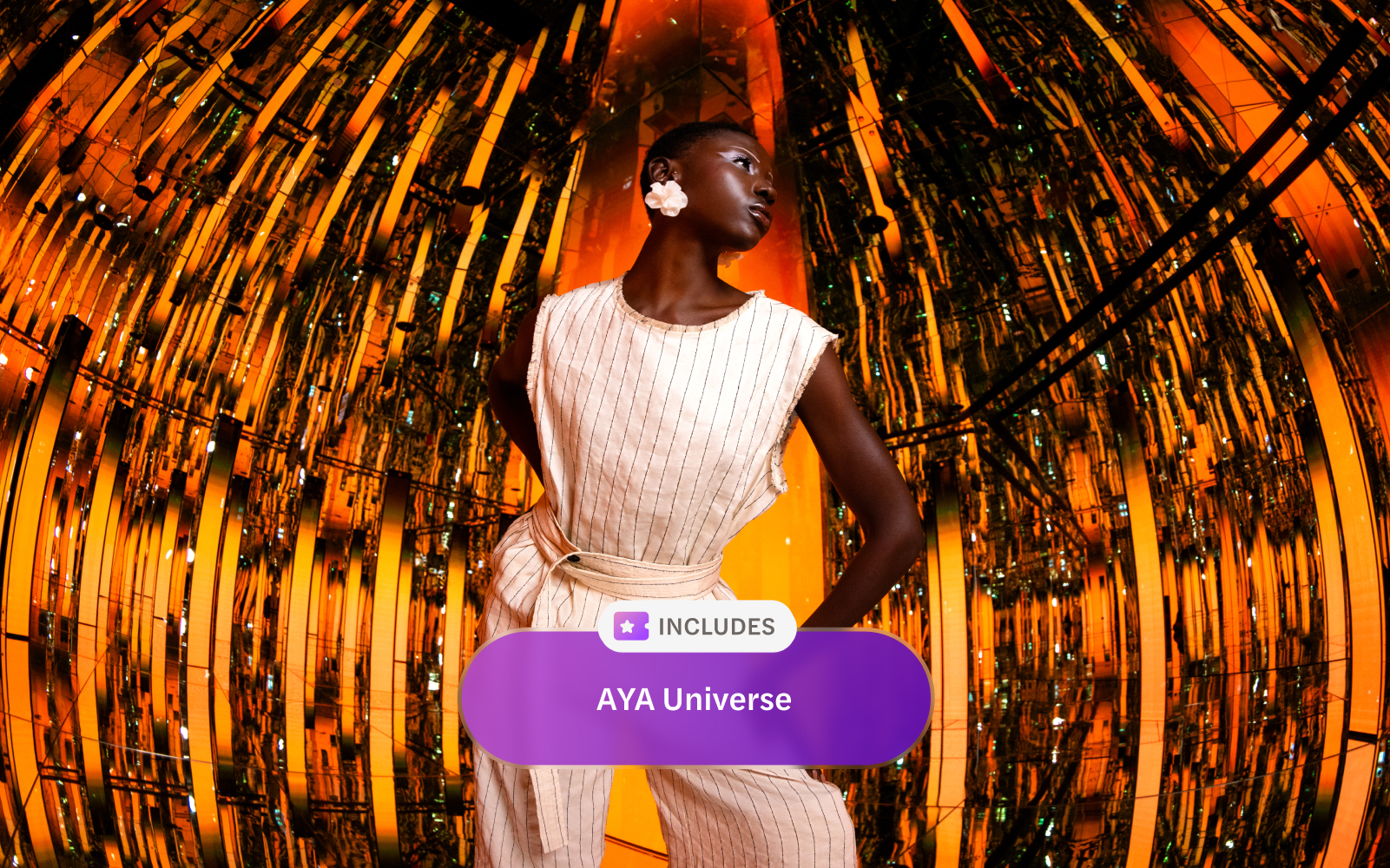 Reflective orange and gold room at AYA Universe with a person standing in the center.