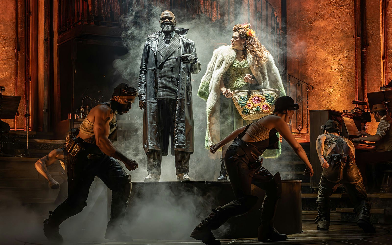 Theatrical performance with actors in dramatic costumes and smoke, related to ghost stories.
