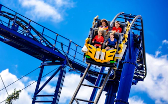 Riders on The Great LEGO Race roller coaster at Legoland Florida.