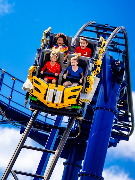 Riders on The Great LEGO Race roller coaster at Legoland Florida.