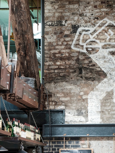 Jameson Distillery interior with whiskey bottles and industrial decor.
