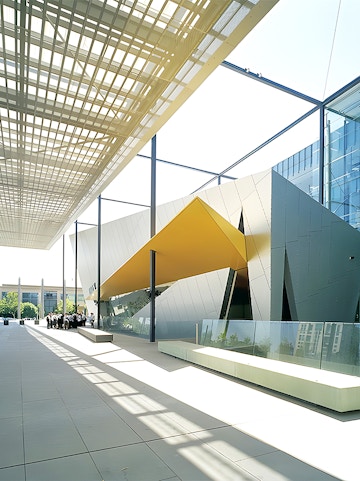 Melbourne Museum entrance with visitors exploring exhibits.