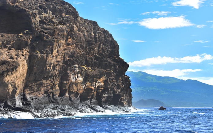Molokini Crater rock formation with ocean view, Island of Maui, Hawaii.