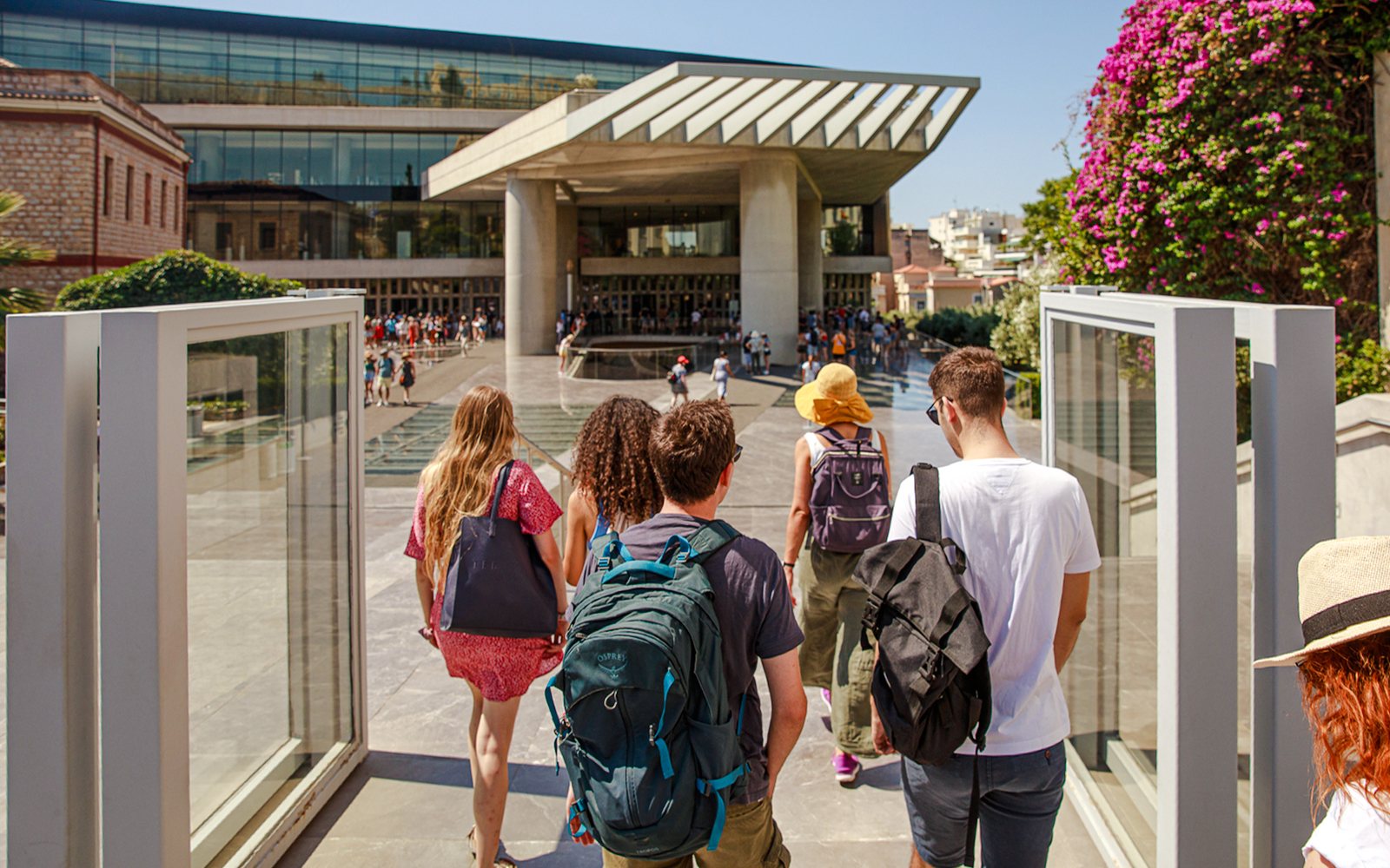 Group entering Acropolis Museum entrance in Athens.