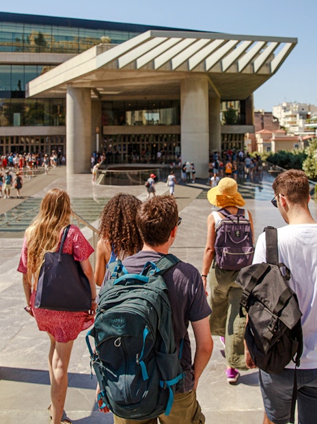 Group entering Acropolis Museum entrance in Athens.