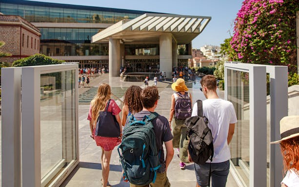 Group entering Acropolis Museum entrance in Athens.