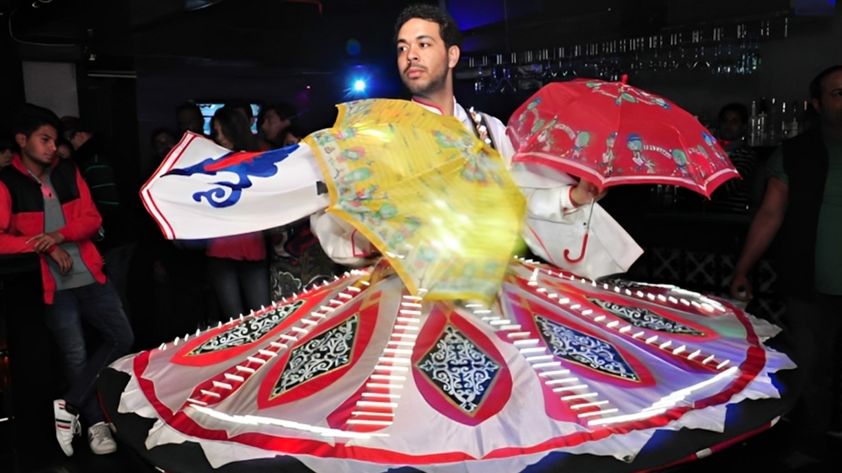 Dancer performing traditional Tanoura dance on Nile River dinner cruise.
