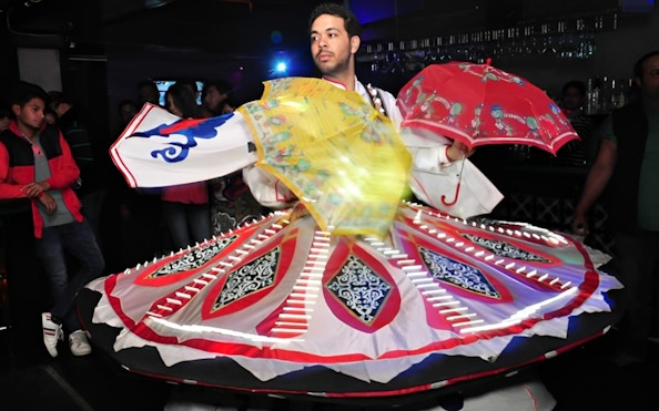 Dancer performing traditional Tanoura dance on Nile River dinner cruise.