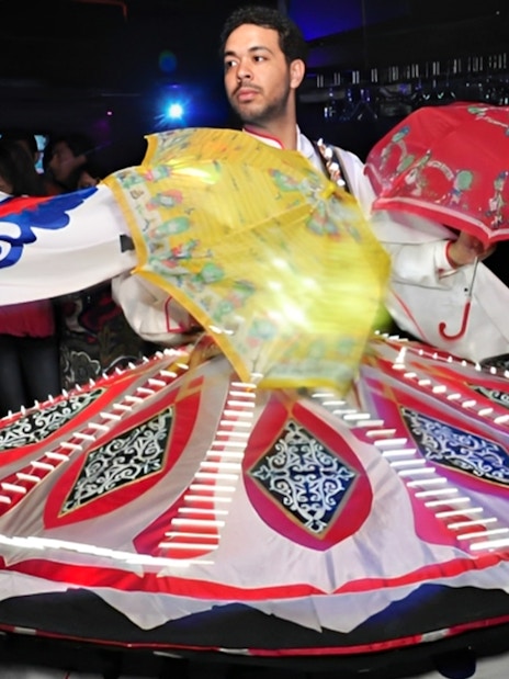 Dancer performing traditional Tanoura dance on Nile River dinner cruise.