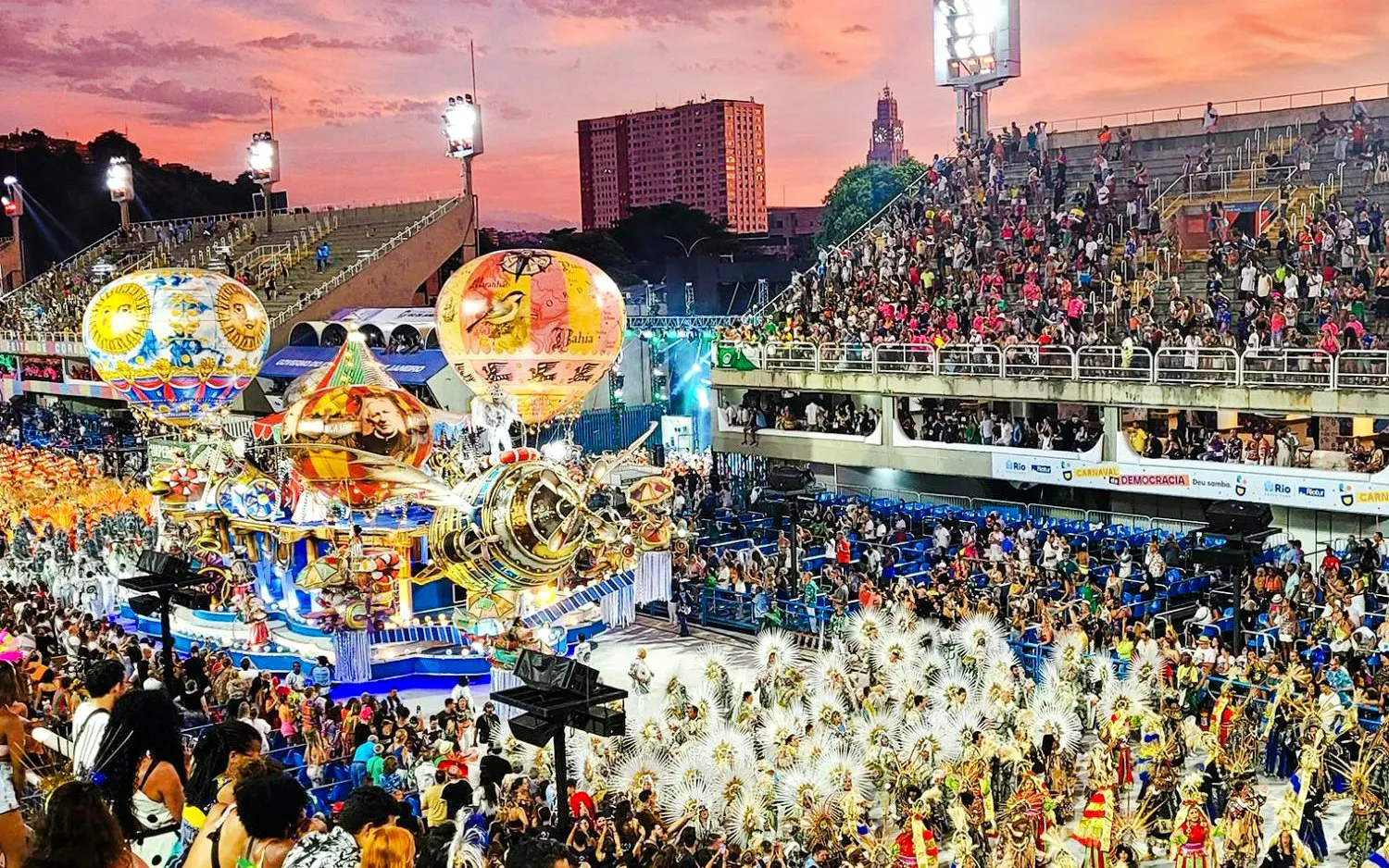 Aerial view of Rio Carnival parade with colorful floats and dancers in Sambadrome.
