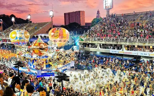 Aerial view of Rio Carnival parade with colorful floats and dancers in Sambadrome.