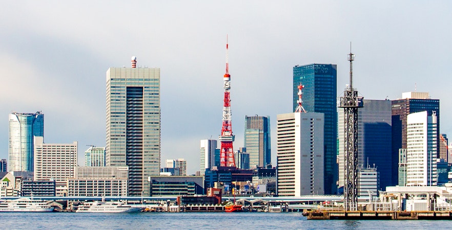 Tokyo Tower and city skyline viewed from Tokyo Bay.