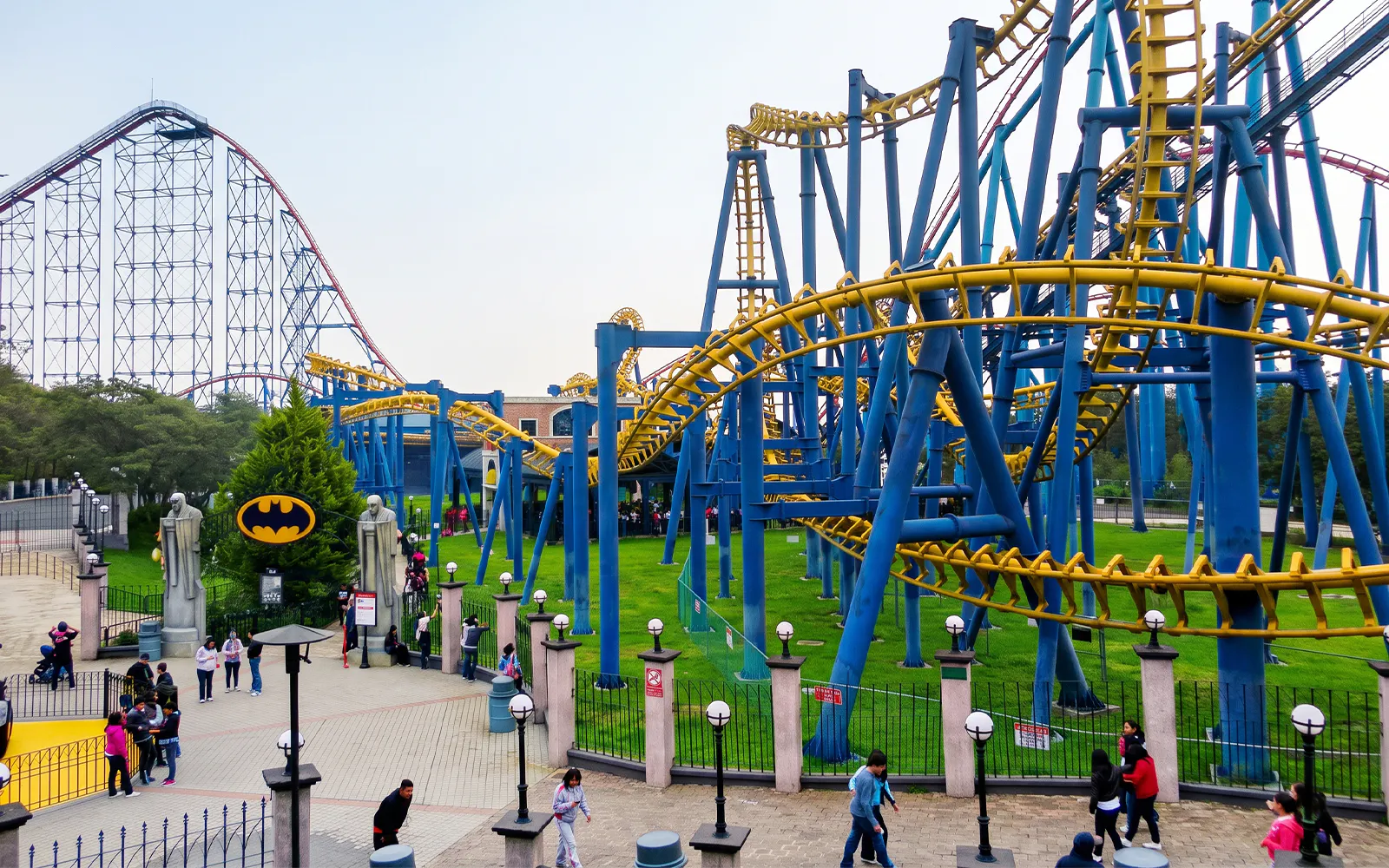 Roller coasters and visitors at Six Flags Mexico theme park.