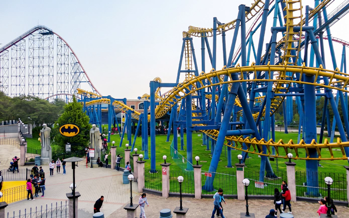 Roller coasters and visitors at Six Flags Mexico theme park.