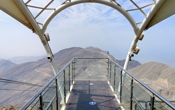 Viewing platform at Jebel Jais Zipline overlooking rocky mountains, Dubai.