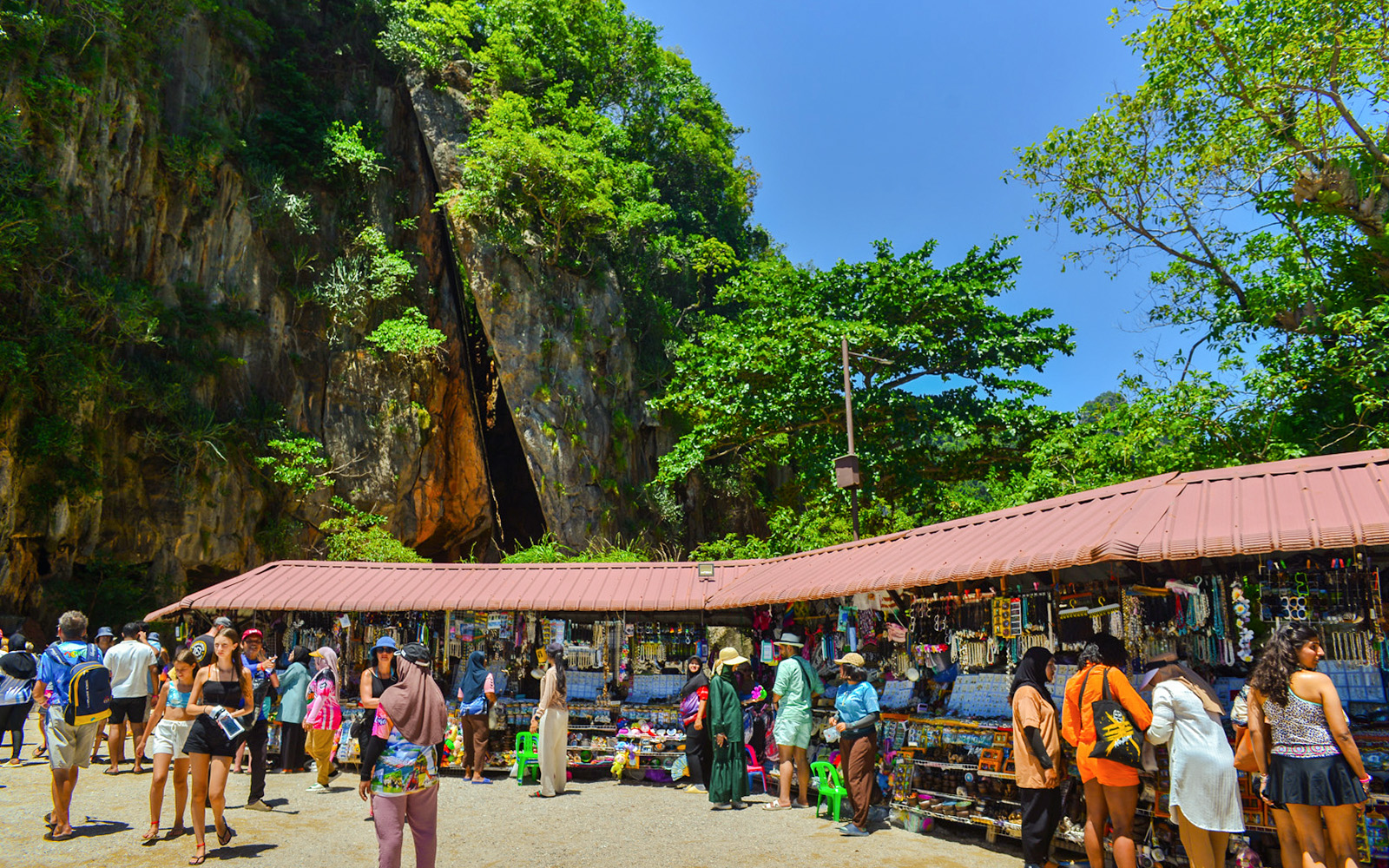 Tourists browsing market stalls at James Bond Island, Phang Nga Bay.