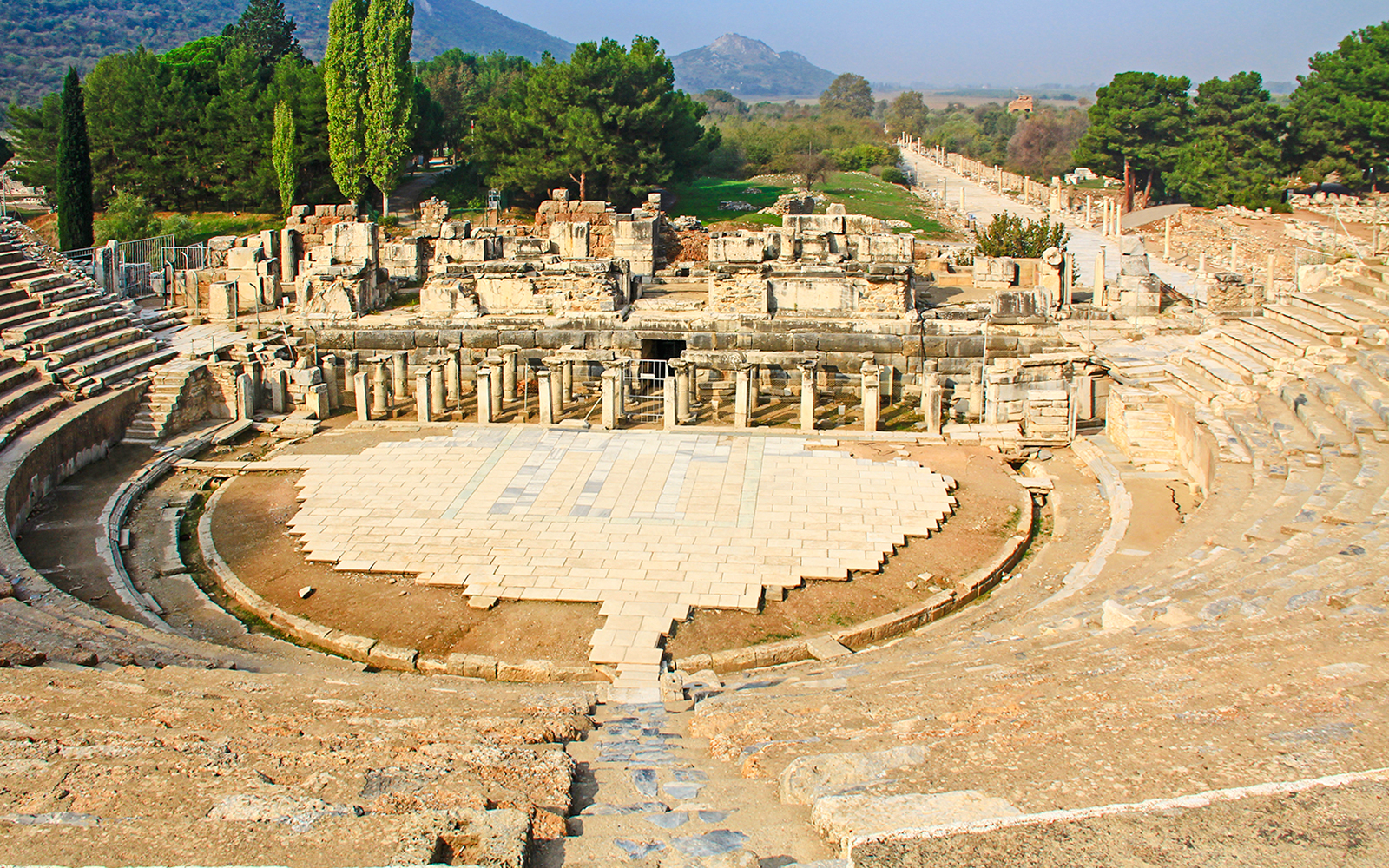 Great Theatre in the ancient city ruins of Ephesus, Turkey, with stone seating and stage.