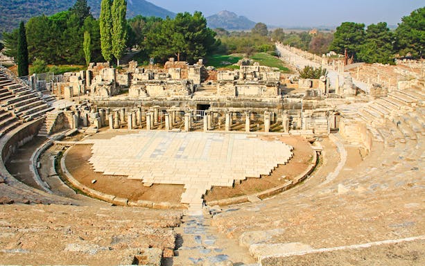 Great Theatre in the ancient city ruins of Ephesus, Turkey, with stone seating and stage.