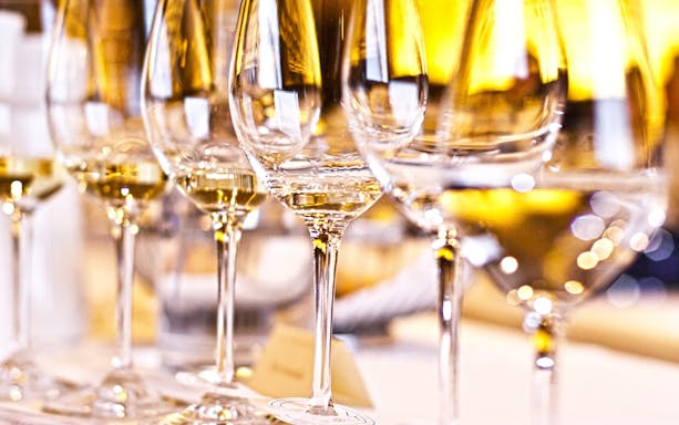 Wine glasses on a table during a Krakow heritage tour.