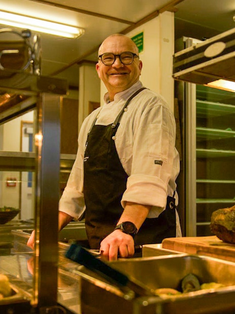 Chef preparing buffet on Doubtful Sound overnight cruise from Queenstown.