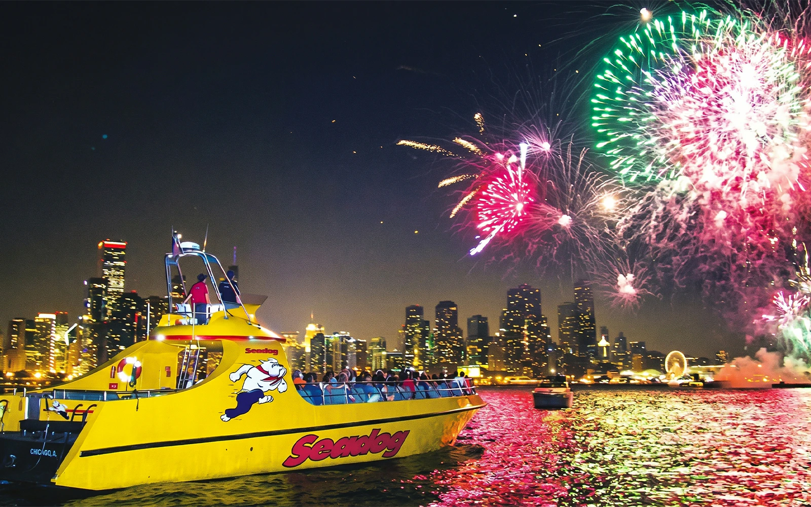 Sea Dog Cruise on Lake Michigan with Chicago skyline and fireworks display.
