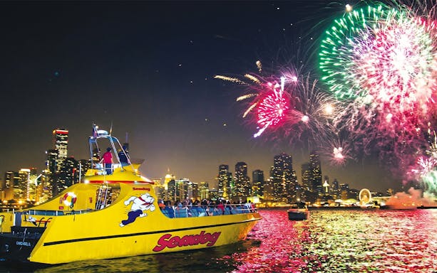 Sea Dog Cruise on Lake Michigan with Chicago skyline and fireworks display.